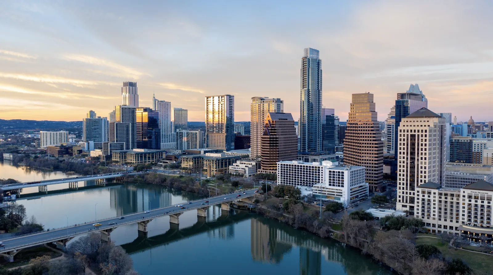 Aerial of downtown Austin and Lady Bird Lake at sunset
